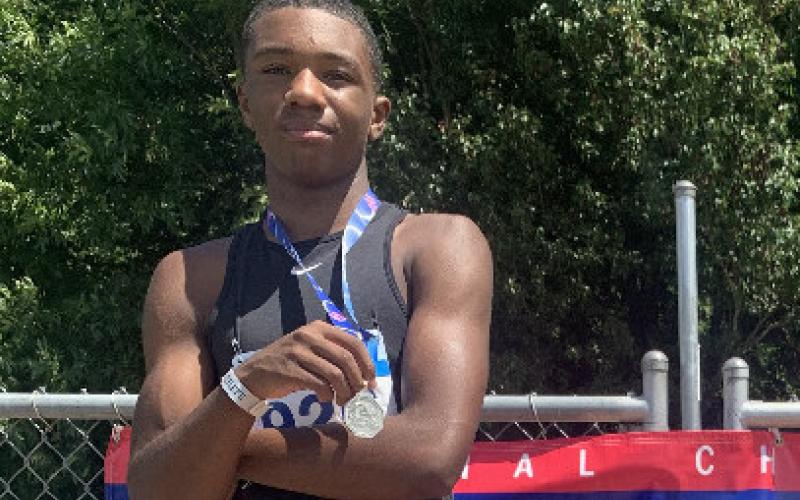 Johnny Carter won second in the 110 meter hurdles and fourth in the 400 meter hurdles.