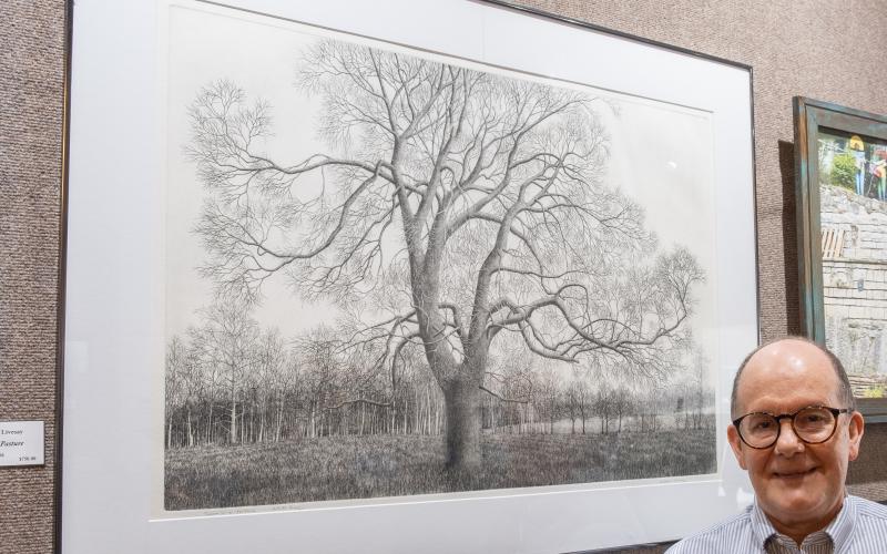 Bill Powell/The Hartwell Sun - William Livesay displays his Best in Show-winning work, Trees in a Pasture at last week’s Juried Art Exhibit.