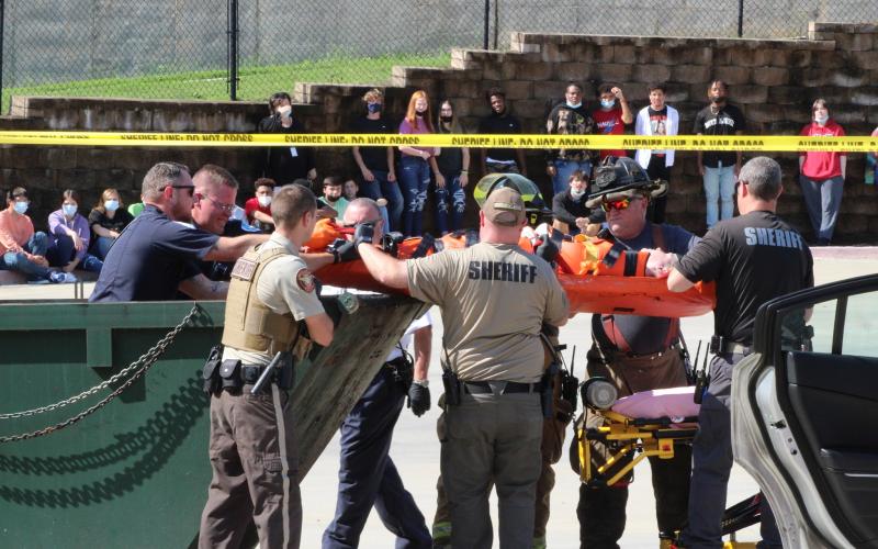 Photo submitted - Detectives, firefighters, officers, coroners and more reenact a crime scene at Hart County High School on Monday, shocking students in a literature class, whose teacher was in on the scheme.