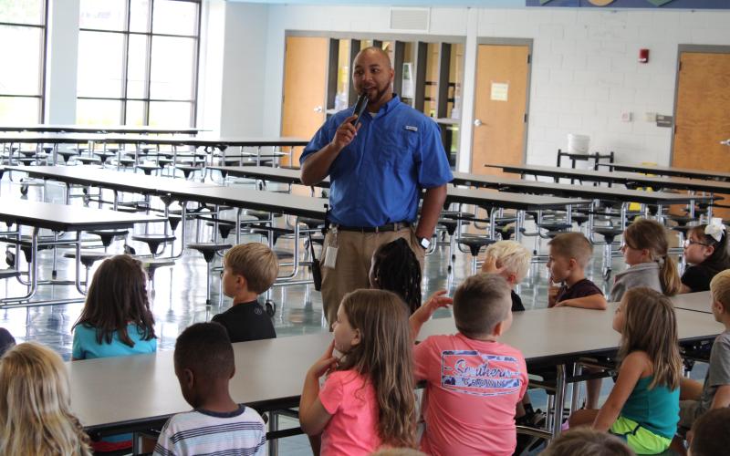 Vice principal Steve Burton talks to students at North Hart Elementary.