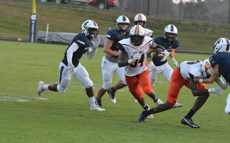 Running back JL Lackey follows his blocks to rack up 200 yards on Hart County’s win over White County on Aug. 26.