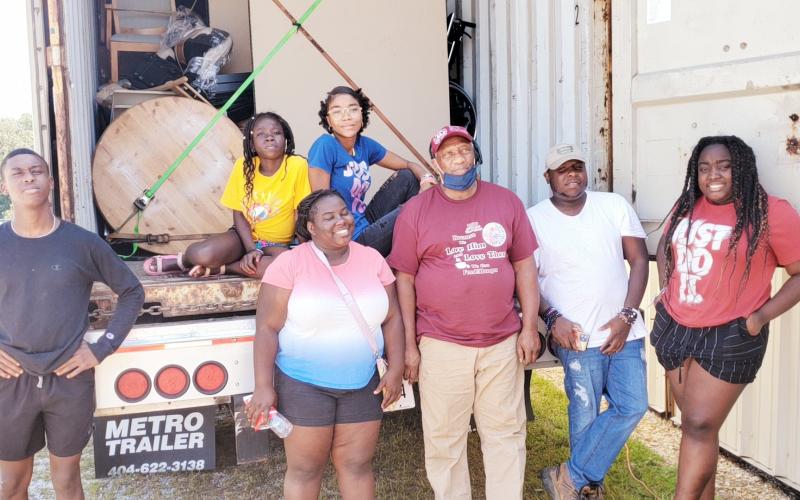 Volunteers in Lavonia on Saturday load a truck full of supplies for Haitians in need after last month’s earthquake. From left to right are Fred, Mirlanda, Belinda, Samaika, Willy (truck driver), Samuel and Redaphca.  All are students at Barnes  Academy, with the exception of Willie, a pastor from Alabama, and Samuel who is in college.