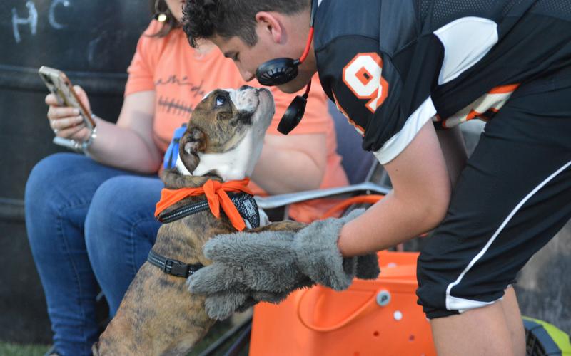 Honey shares a moment with mascot Zander Horne at the North Hall football game.