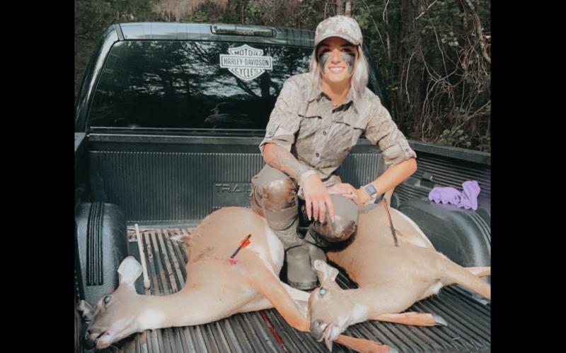 Hartwell resident and rookie hunter Makenzie Clark proudly displays the result of her first ever bow shot.