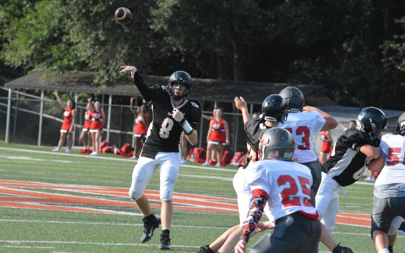 Quarterback Brice Williamson throws a pass against Madison County Middle School on Thursday, Sept. 9.