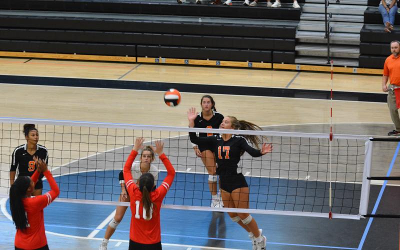 Dakota Phillips (17) taps the ball over the net against Stephens County.