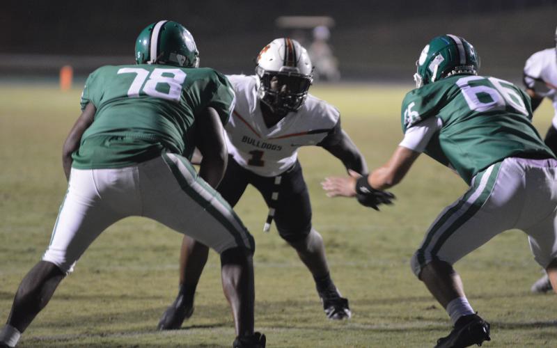 Defender Keegan Dye takes on a double team against Franklin County on Friday.