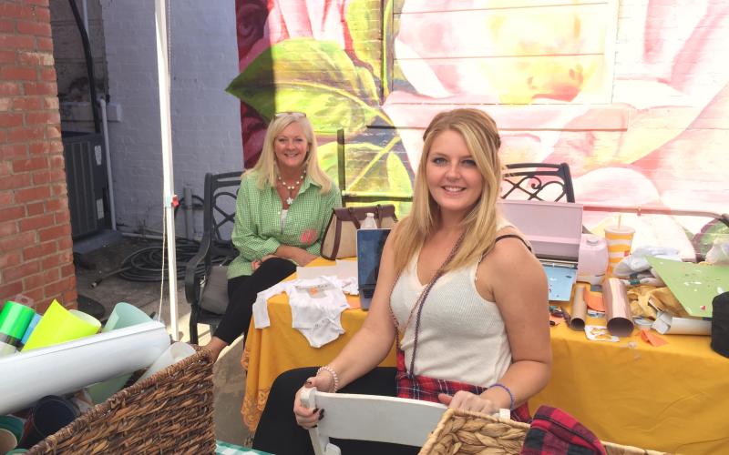 Amelia and Alexis Hays show off their fashion line at the Hartwell Makers Festival.