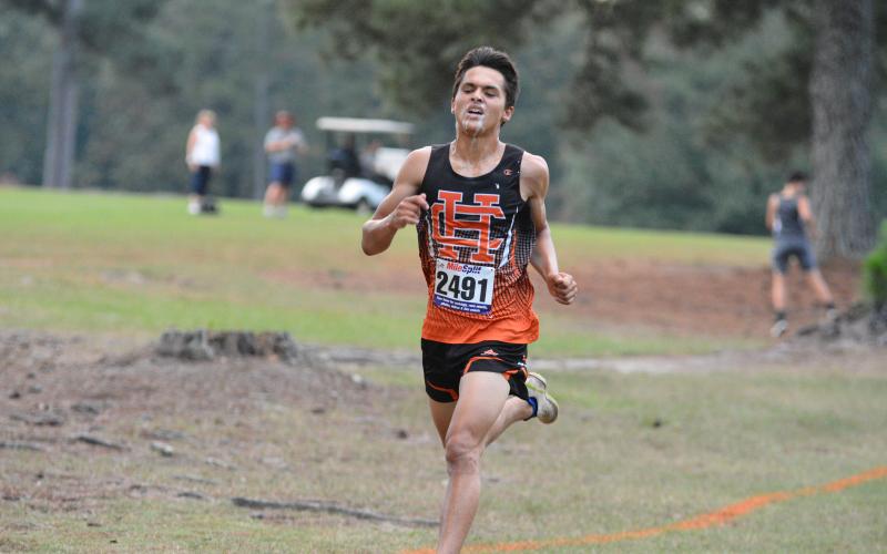 Diego Martinez slobbers like a bulldog as he approaches the finish line.
