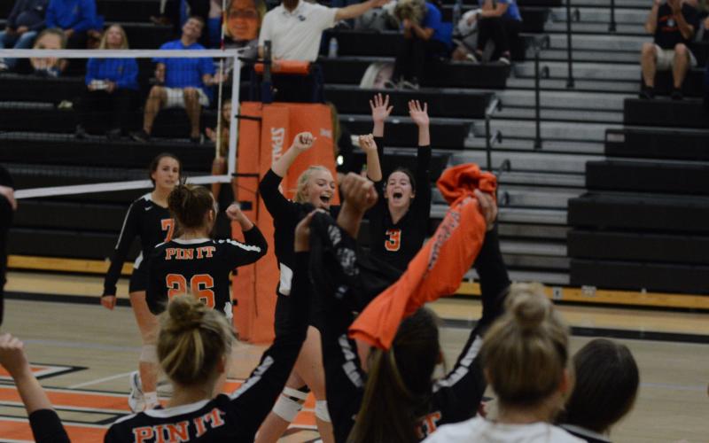 he team and sideline erupt as the Volleydogs score their final point against Ringgold on Tuesday, Oct. 19.