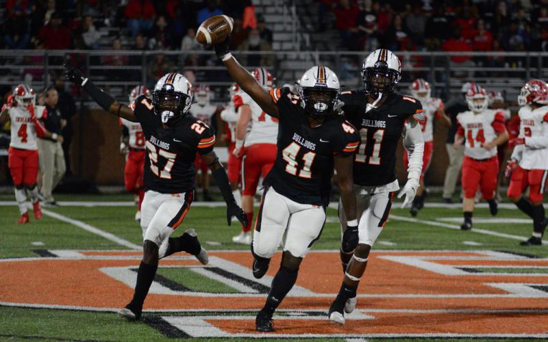 Drew Dotson/ The Hartwell Sun-Jay Merritt (41) recovers the fumble on Stephens’ first drive of the game and Josh Jones (27) and Keith Curry (11) follow behind in V-formation.