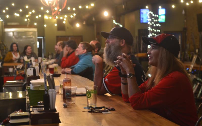 Fans of the Atlanta Braves fill the bar at Southern Hart Brewing in Hartwell on Tuesday night, watching the late innings of the Braves’ first World Series title in 26 years.