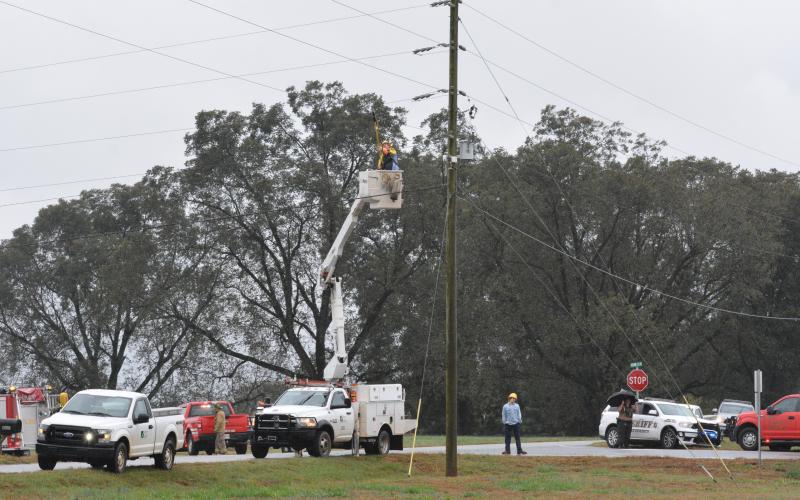 A technician fixes a power line moments after it was entangled with a boom truck, causing a man to be electrocuted.