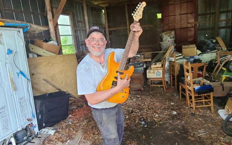 Photo submitted In his retirement, amall engines mechanic Johnny Segers enjoys picking up old hobbies like playing guitar.