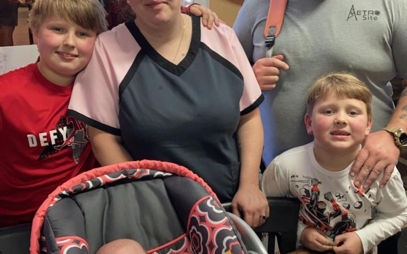 Lauren and Alex Emmons with their three children.