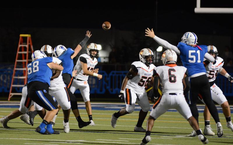 Drew Dotson/ The Hartwell Sun Quarterback Austen Whitworth threads the ball between the outstretched arms of Ringgold linemen to Malachi Kelley in the team’s loss on Nov. 12.