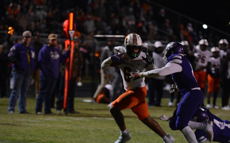Malachi Kelley fights off a defender in the team’s loss to Monroe Area on Nov. 5.