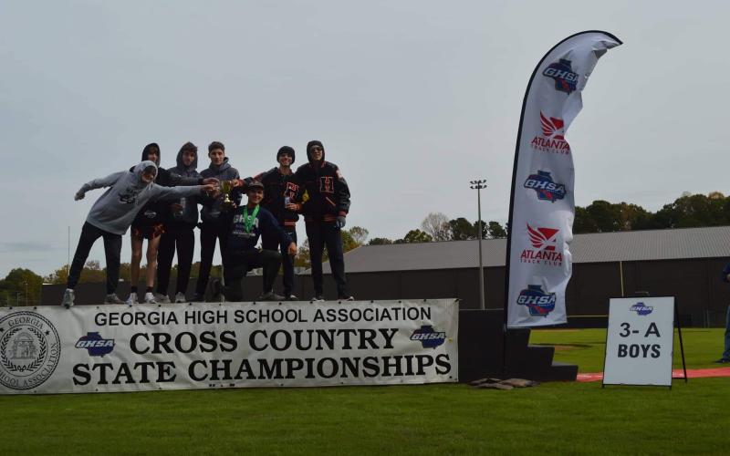 The boys pose with their third place cup.
