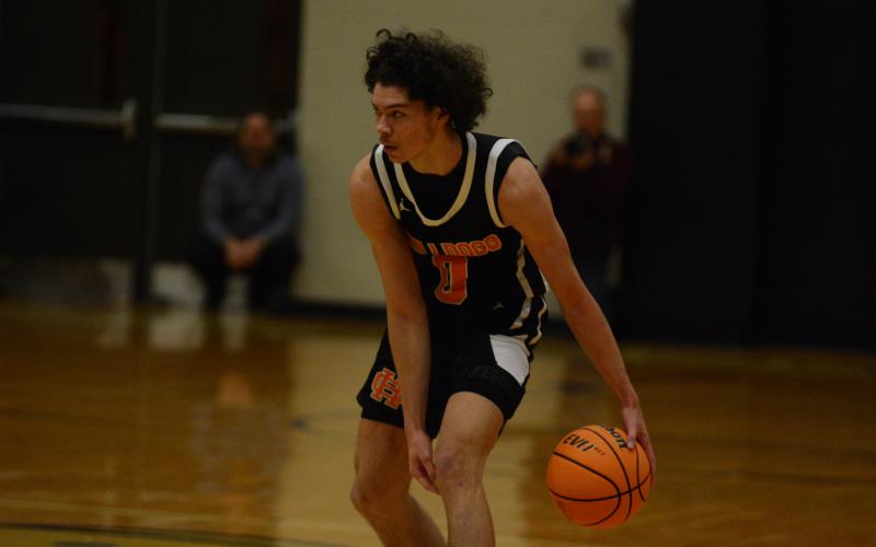 J.C. Curry eyes the T.L. Hanna defense looking for an opening.