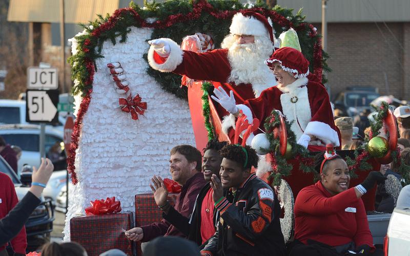 Santa, Mrs. Claus and several float-riders wave to the crowd at the 2019 Hartwell Christmas Parade.
