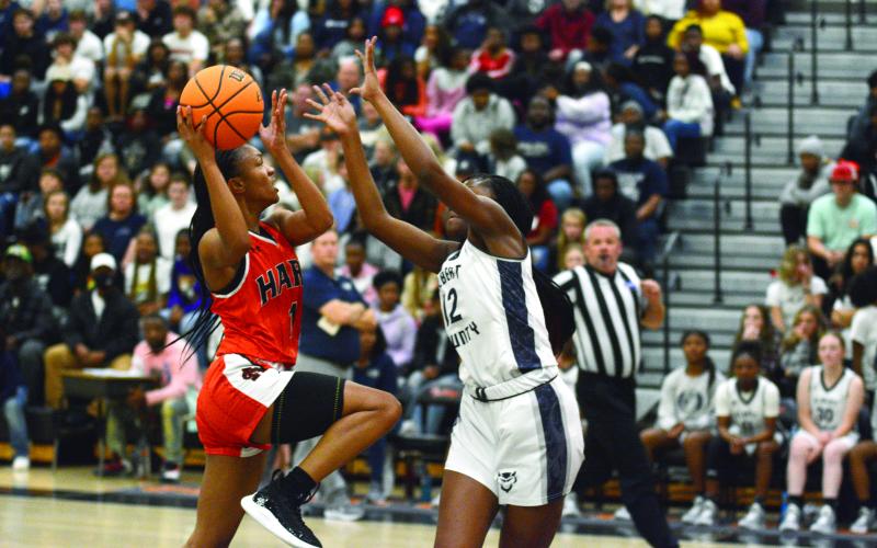 Valasha Carter shoots over the outstretched hands of an Elbert County defender on Dec. 3.