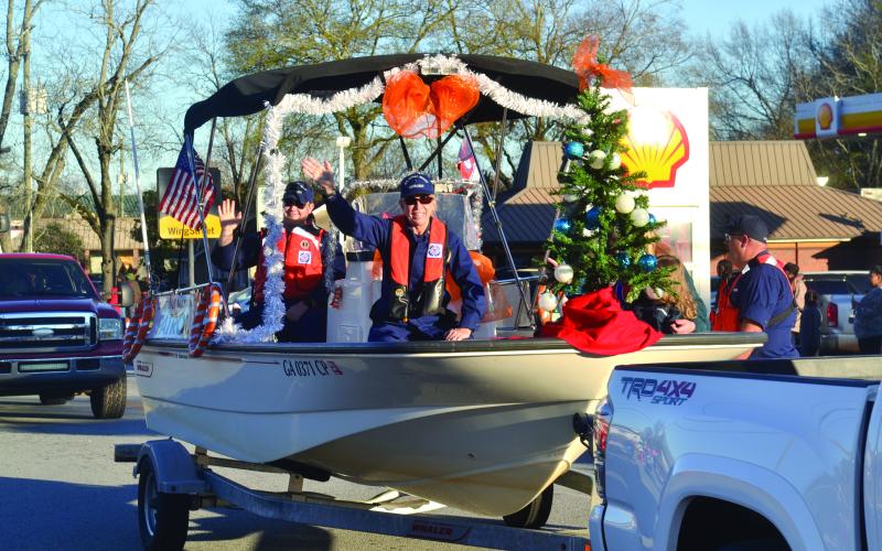 The U.S. Coast Guard Auxiliary makes its way through town as part of the 2021 Christmas parade in Hartwell.