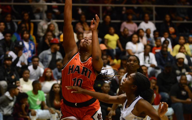 Pashay Saddler shoots off the rebound over the Elbert County defender on Dec. 17 in Elberton.