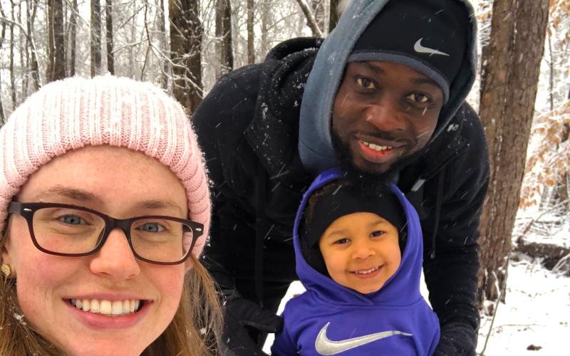Kerv Augustin and his wife Rachel enjoy the snow with their daughter Eleanora Grace. Their youngest two, Margot and Killian, are not pictured.
