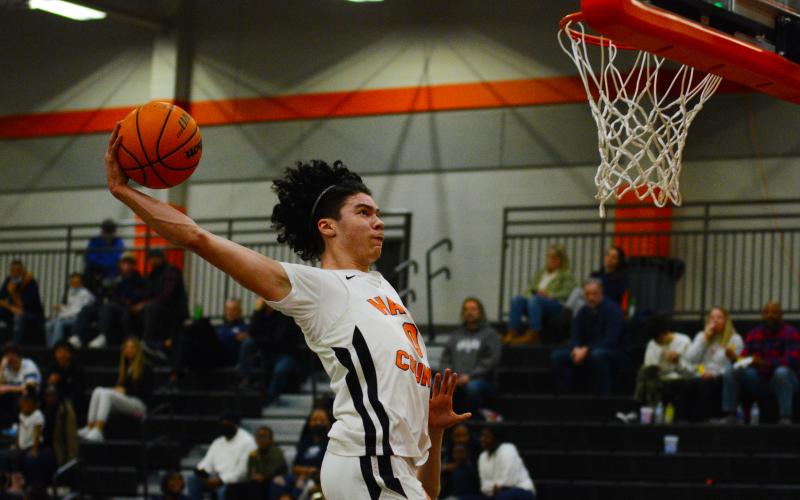 Senior Johnny Curry slams down in the 78-46 win over East Jackson on Friday night.