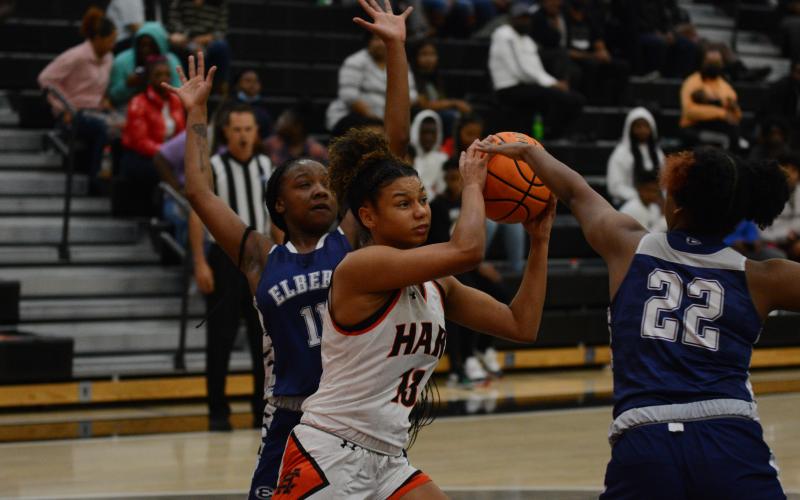 Alexis Walker tries to get a shot off against a stiff defense.