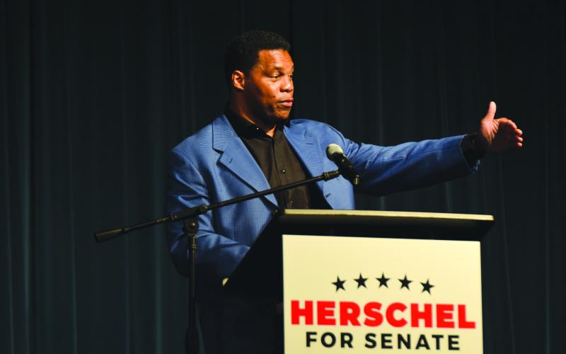 Football legend and Senatorial candidate Herschel Walker speaks at the Northeast Georgia Republican rally in Franklin Springs on Saturday.