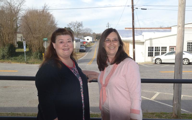 Dan Hunt/The Hartwell Sun - Women Build ambassador Michelle Wetherbee, left, alongside Hart County Habitat director Darlene Nixon, right.