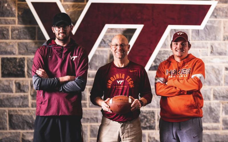 Stewart Carter, middle, alongside assistants Rex Bennett (left) and Hayden Whitley (right).