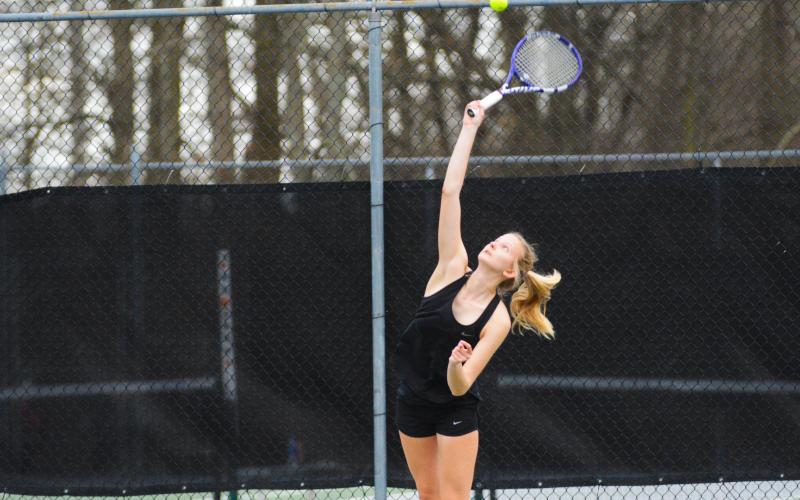 Ava Carnes serves in her win over Elbert County.