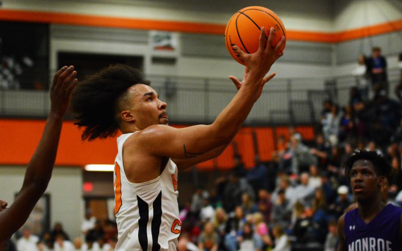 Sean Teasley lays up the ball against Monroe Area in the region tournament semifinals.