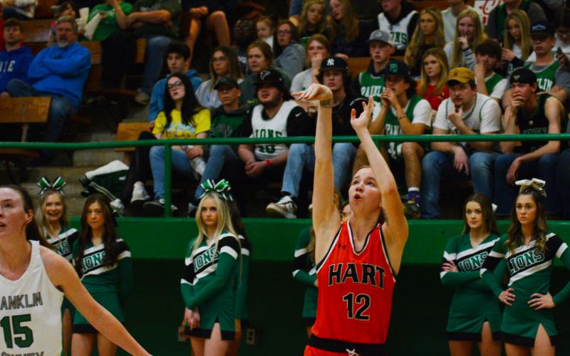 Drew Dotson/ The Hartwell Sun Madison McLane sinks a three in front of the Franklin County cheerleaders.