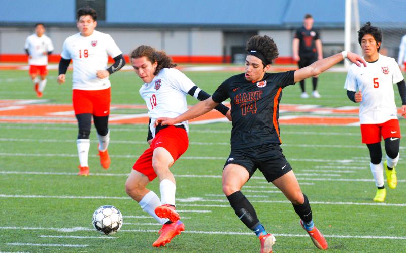 Tyler Trujillo fights for possession against the Rabun County player.