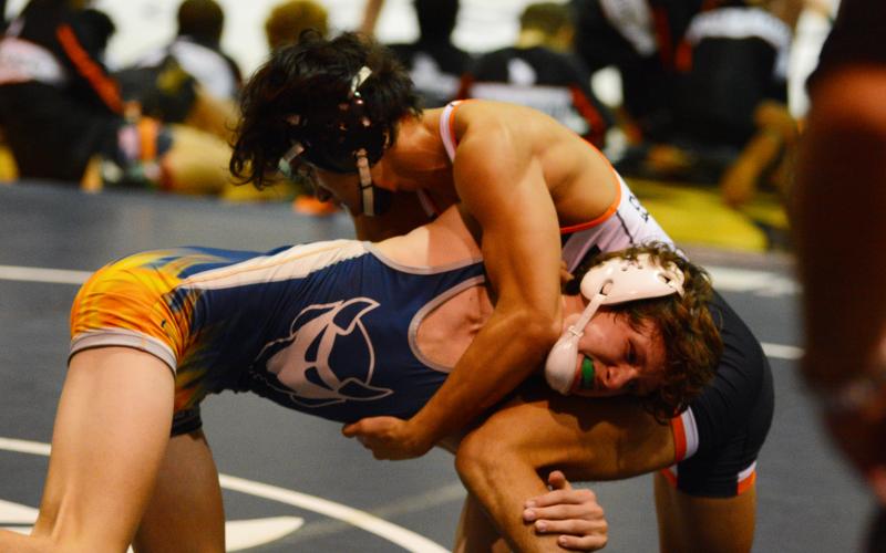 Miguel Jaimes fights for control with an Elbert County wrestler earlier this season.