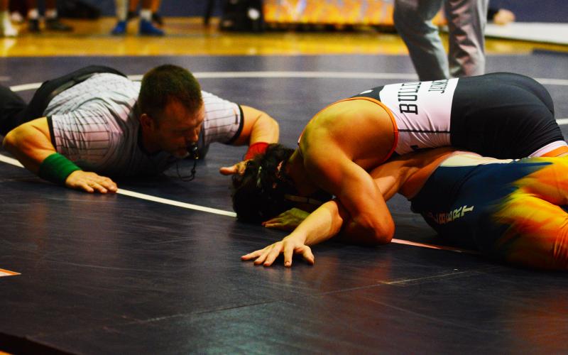 Drew Dotson/ The Hartwell Sun - Miguel Jaimes fights for a pin against an Elbert County wrestler earlier this season.