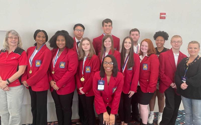 Pictured from left to right are, back row, Ethan Ho, Jonathan McClain, Ivan Martin, Louiesa Gibbs, middle row, Advisor Ms. Vicky Carter, Terriah Bush, Zion Lackey, Bella Chapman, Anna Hunt, Georgia Tucker, Savana Kotal, Sawyer Boyd, Advisor Erica Robertson and, front row, Arionya Gude.