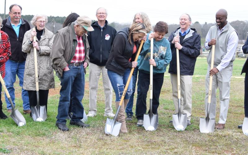 Northeast Georgia Animal Shelter board members, staff and supporters celebrate the groundbreaking for its new building Thursday afternoon.