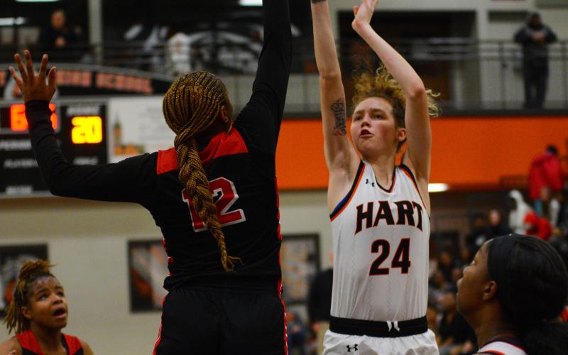 Abbygail McLane shoots over one of her opponents.