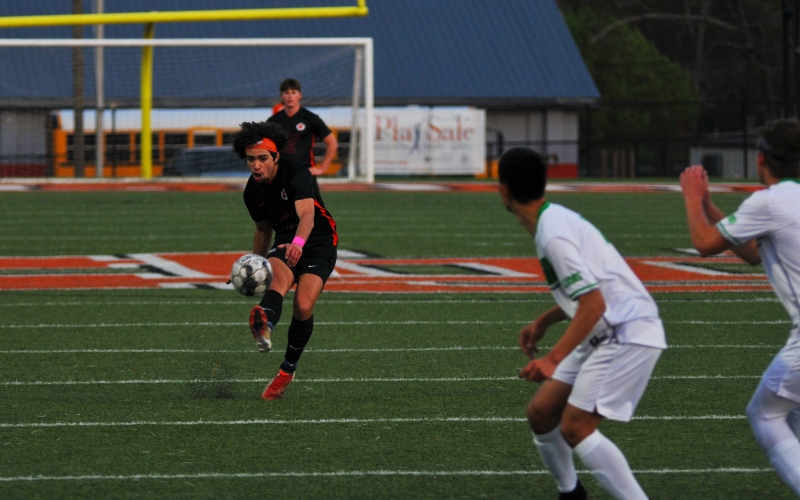 Tyler Trujillo curves his shot around the wall to score a goal off a free kick in the win over Franklin County on March 25.