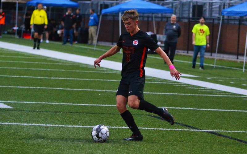 Kyle Hubbard crosses the ball in his hat-trick performance.