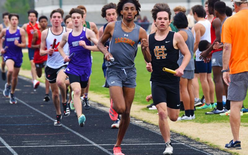 Braden Whitson leads the pack in the boys distance medley race at East Jackson High School  on March 5.