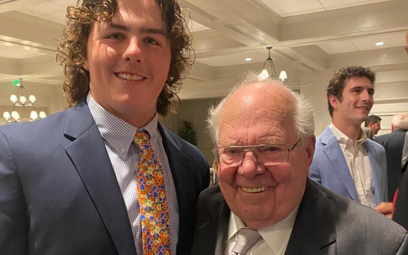 Hart County High School senior Peyton Powell alongside sports broadcasting legend Verne Lundquist at the National Football Foundation University of Georgia Chapter awards ceremony held Monday, April 18. Georgia quarterback Stetson Bennett is also pictured.