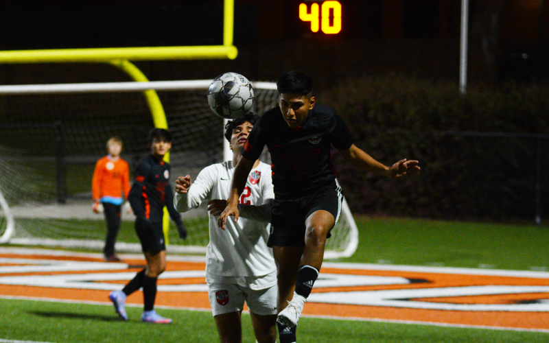 Drew Dotson/ The Hartwell Sun - Jonathan Gench-Cortez heads the ball away from the Madison County attacker on Thursday, April 7.