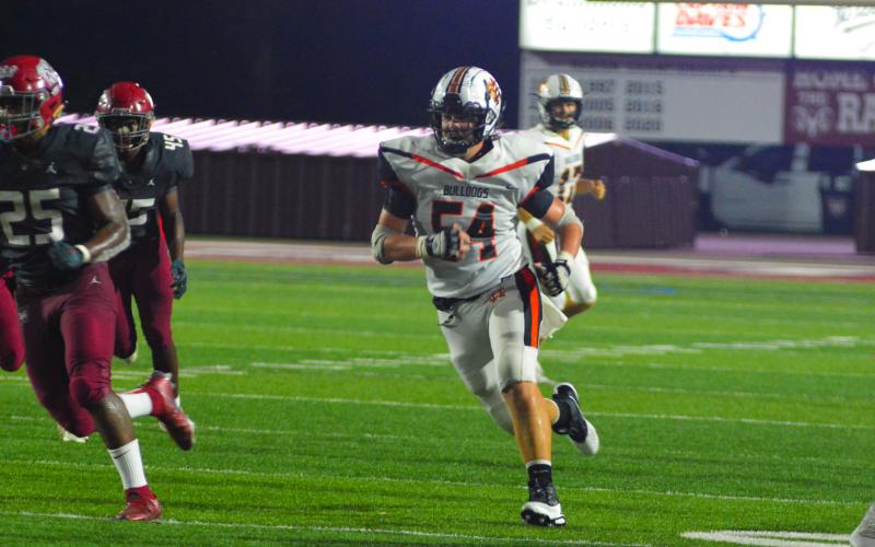 Peyton Powell looks for a block down field during last season’s game against Westside.