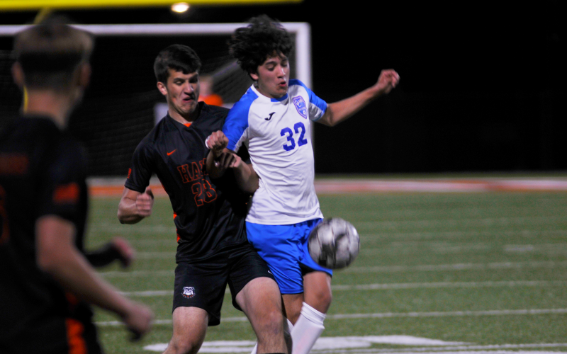 onathan McClain fights through an Oglethorpe defender for the ball on April 1.