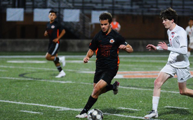 Senior Aidan Gordon pushes the ball down field in his last home game as a Bulldog.